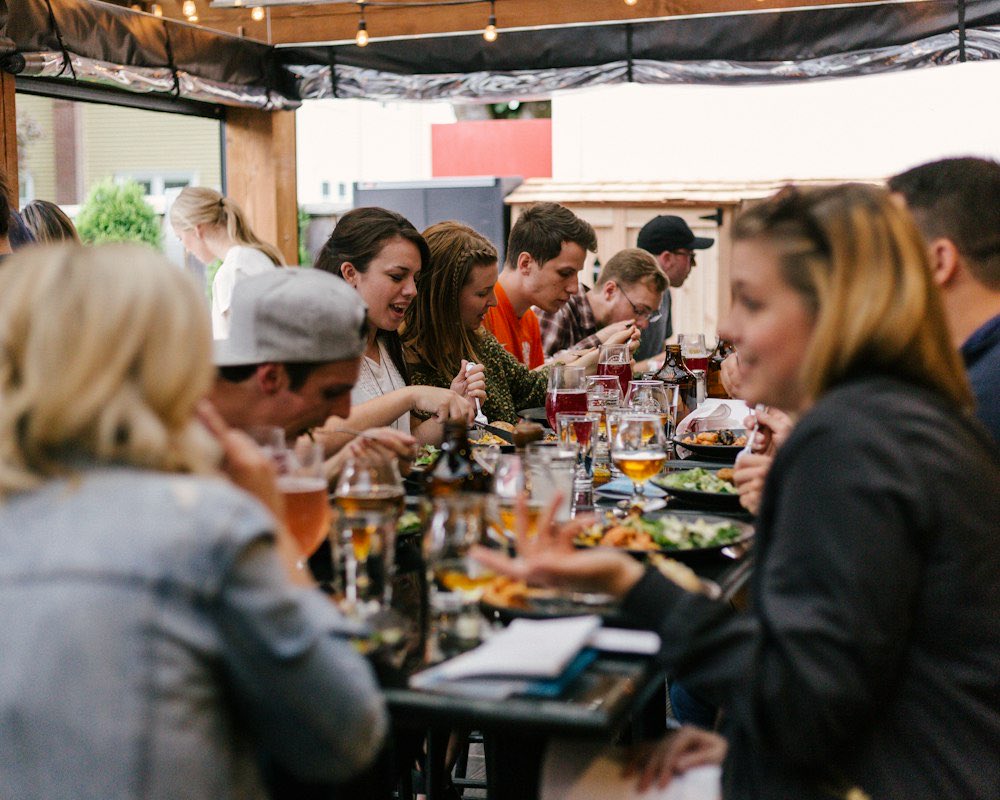 People sharing a meal outdoors